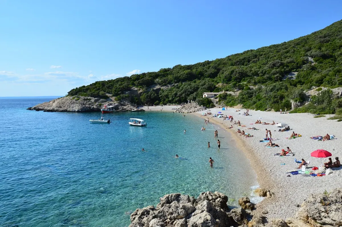 Sveti Ivan beach on Cres — white pebbles below the Lubenice cliffs.